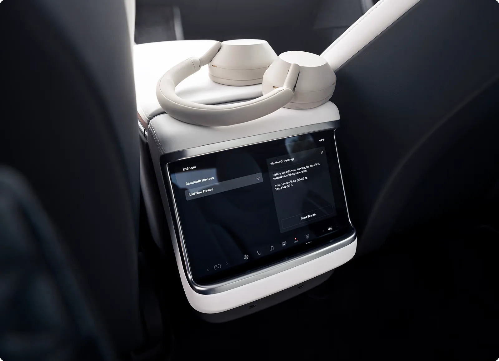 Rear seat entertainment display with premium headphones