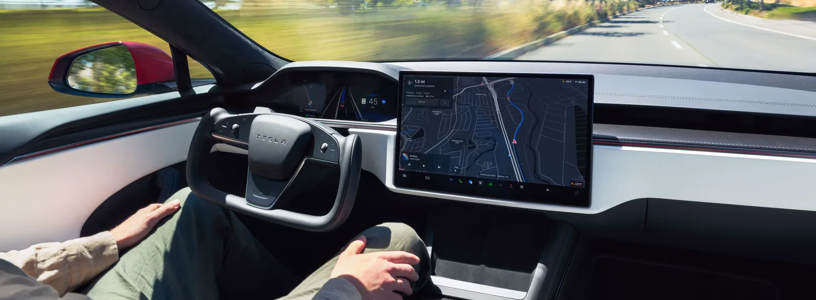 Model S interior with yoke steering wheel and landscape display